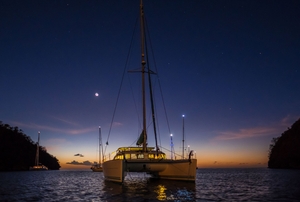Boat on the water at night, night time boating concept.