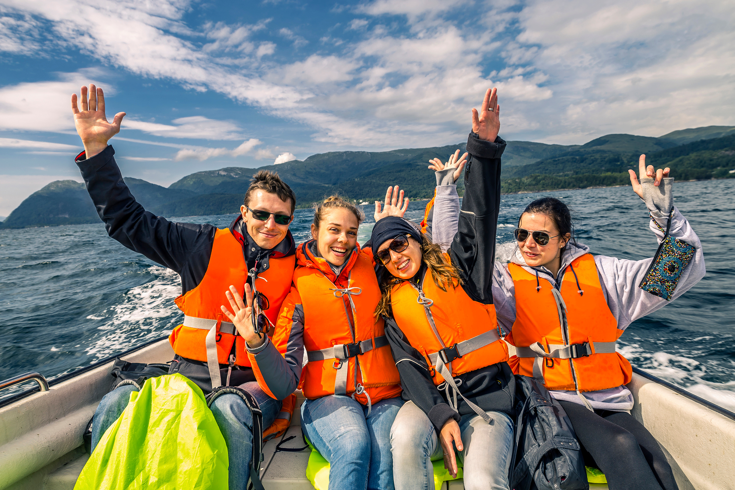 Adults wearing life jackets on a boat, common boating questions and answers concept. 