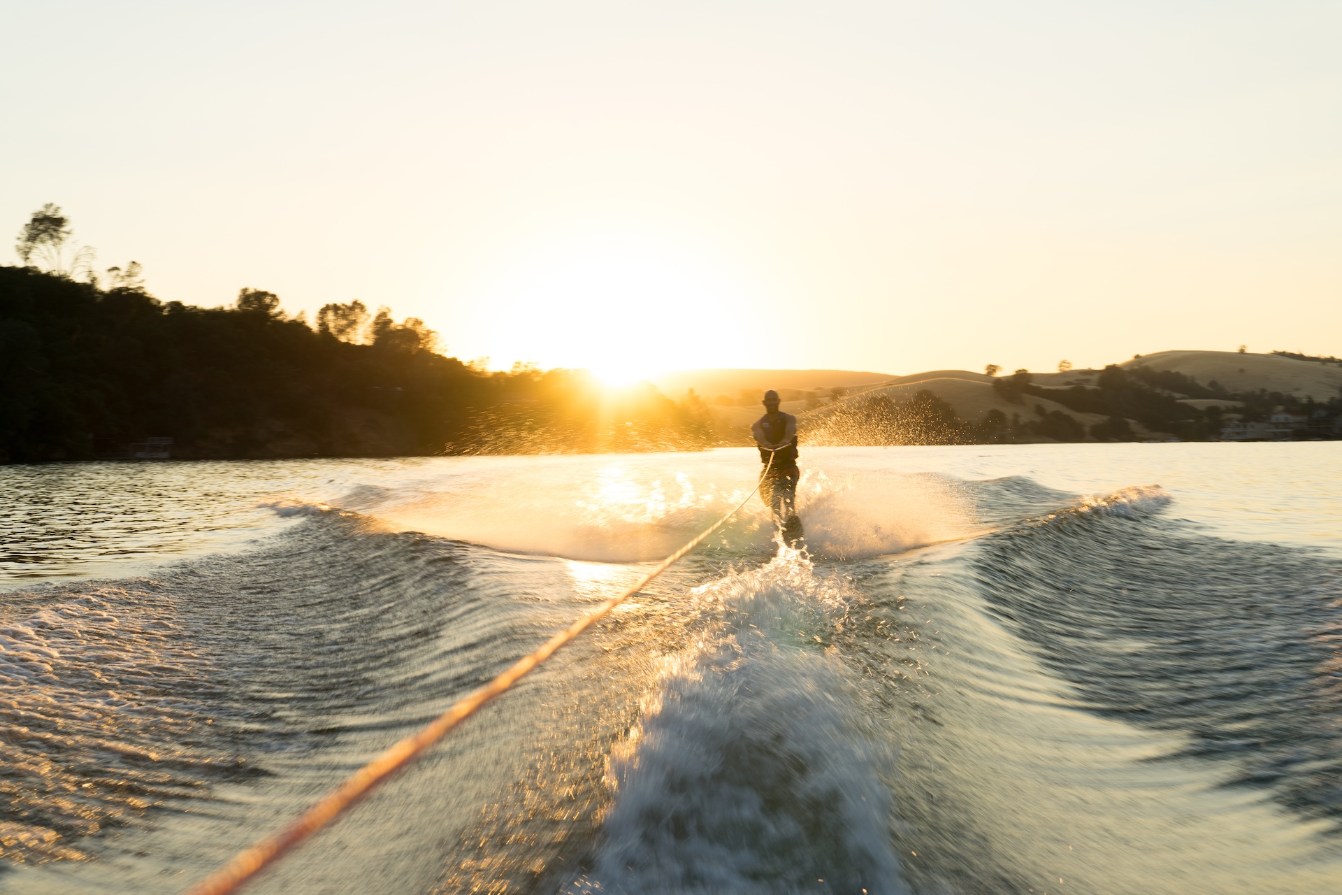 Person water skiing behind a boat, is water skiing dangerous concept?