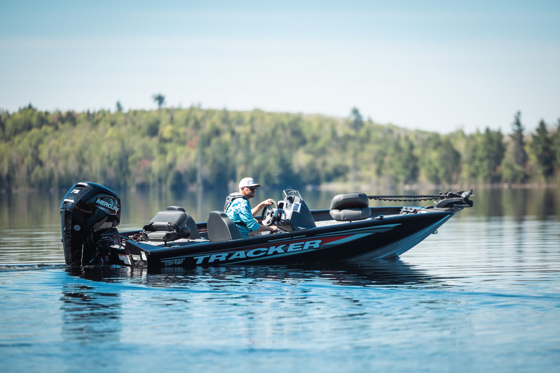 Angler driving a fishing boat slowly, get an Alberta boating license concept. 