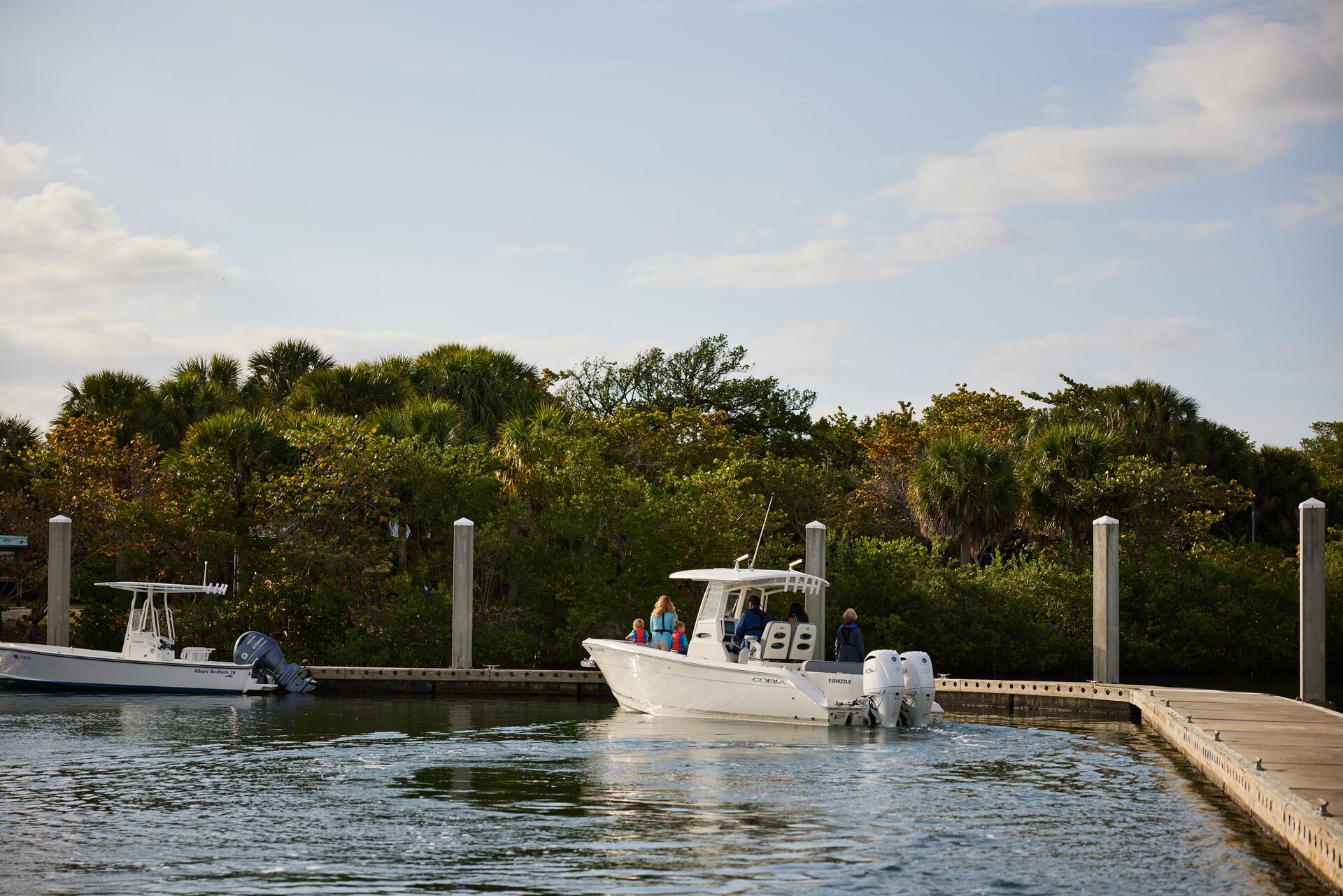 Boat at dock in marina before launch, casting off with wind concept. 