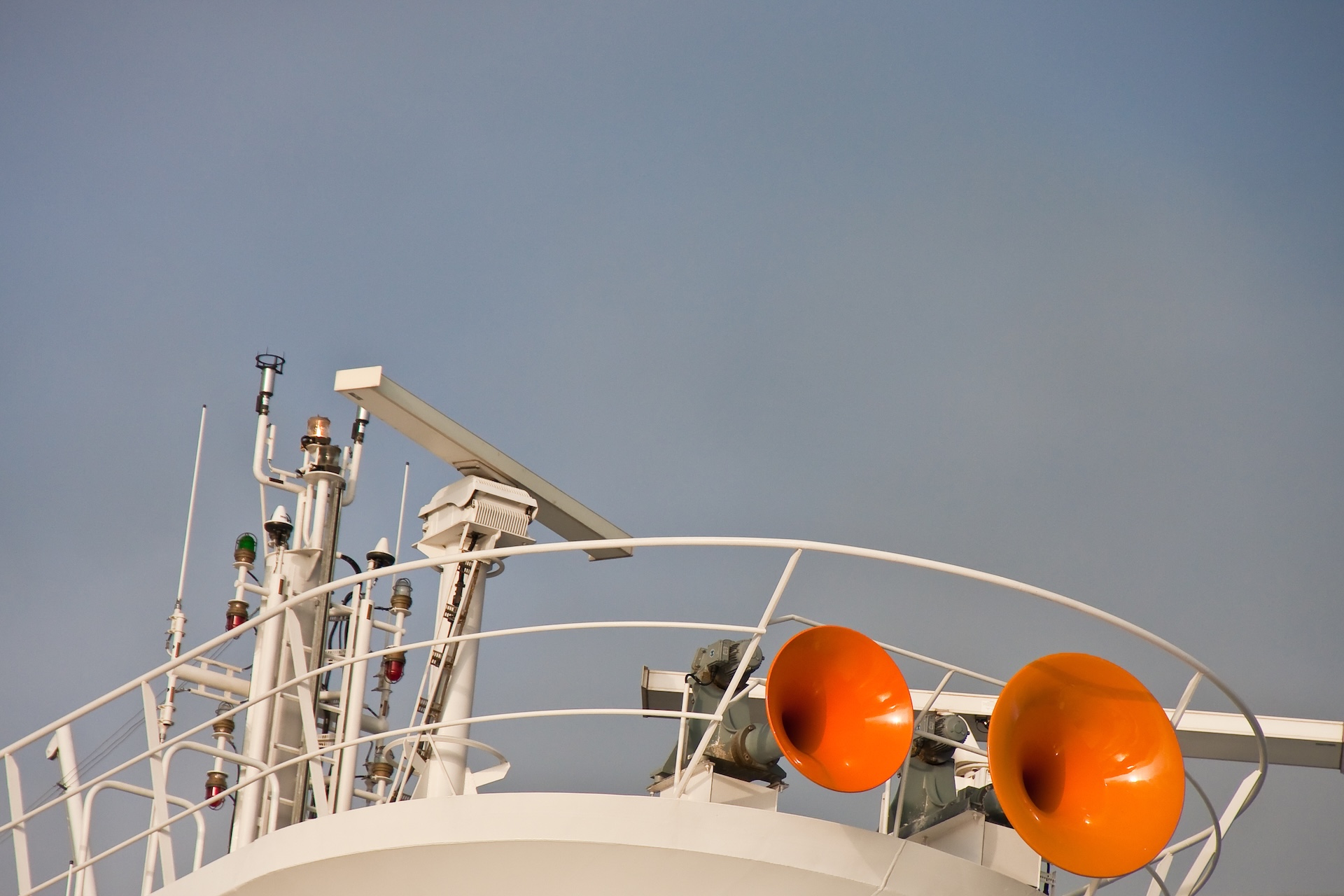 Set of orange horns on a boat, understand ship horn signals concept. 