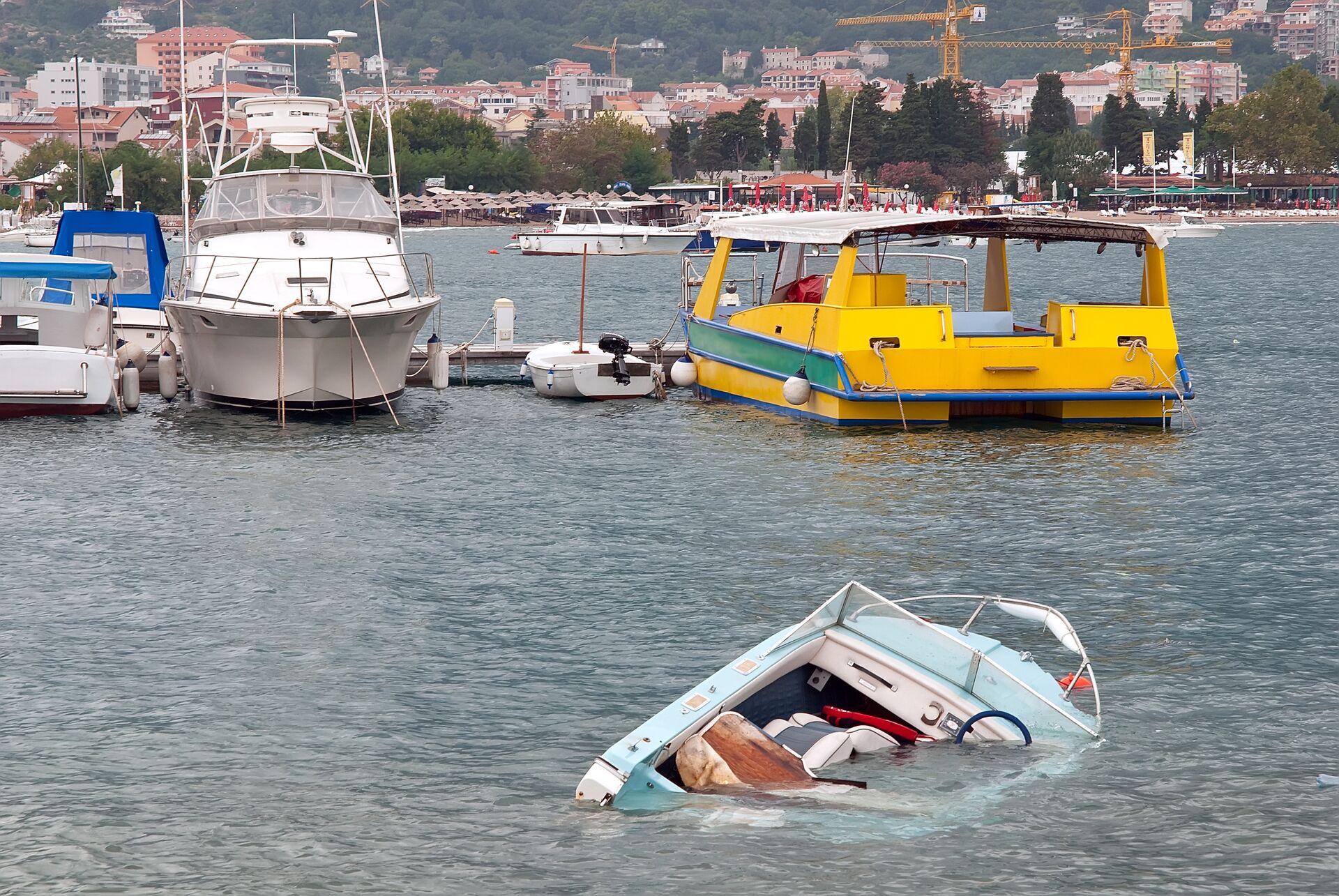 A boat sinking in the water, respond to boating emergency concept. 