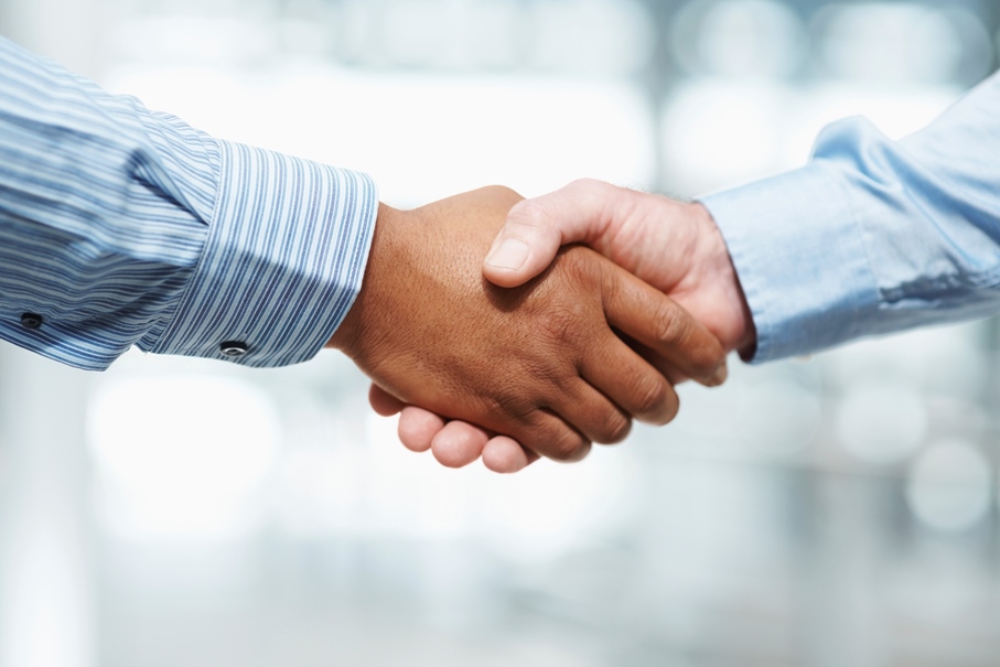 Close-up of a handshake, boat-sharing agreement concept. 