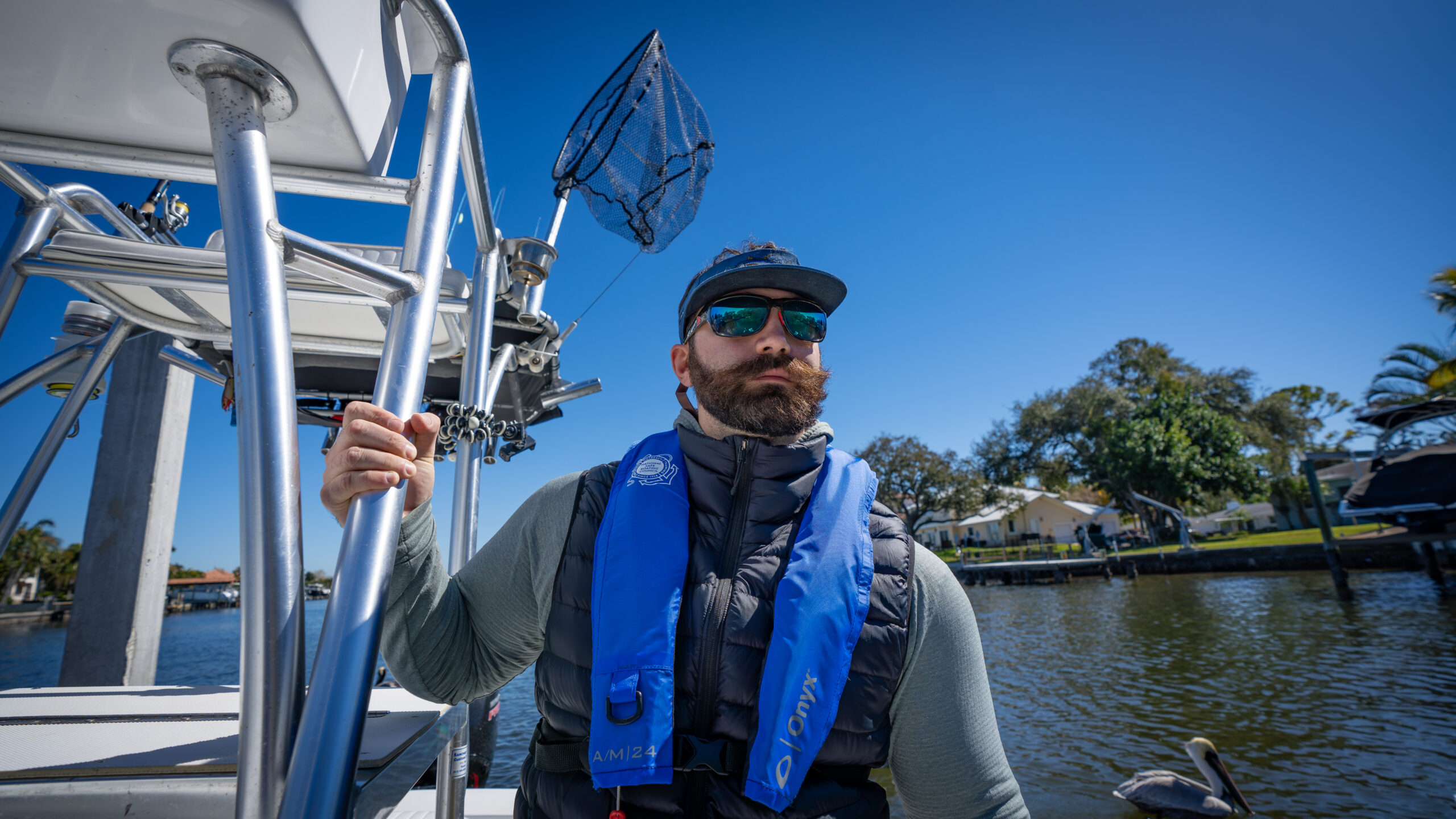 Person on boat wearing inflatable life jacket, best inflatable life jacket concept. 