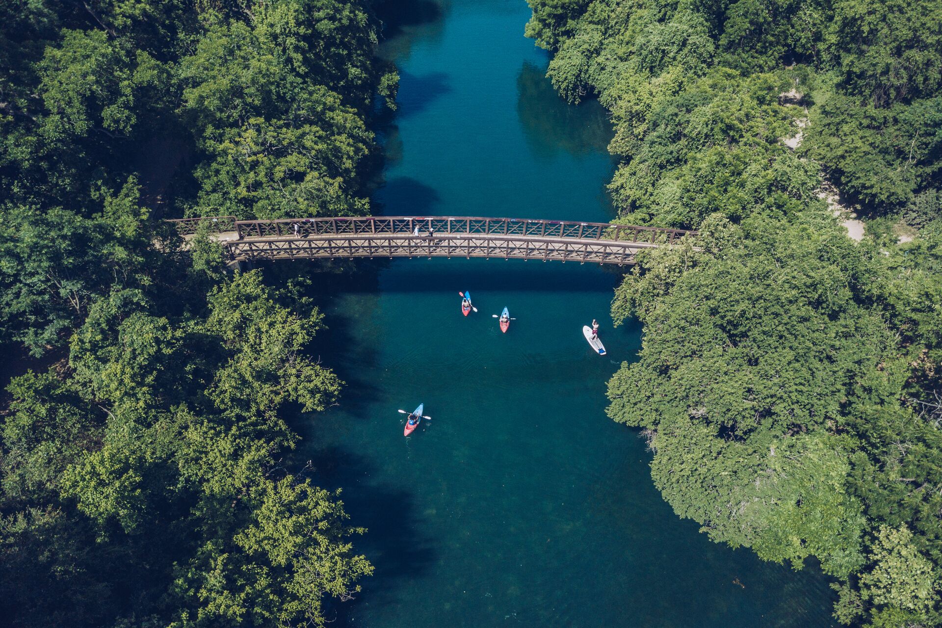 Aerial view of small boats on a river, river hazards boating concept.