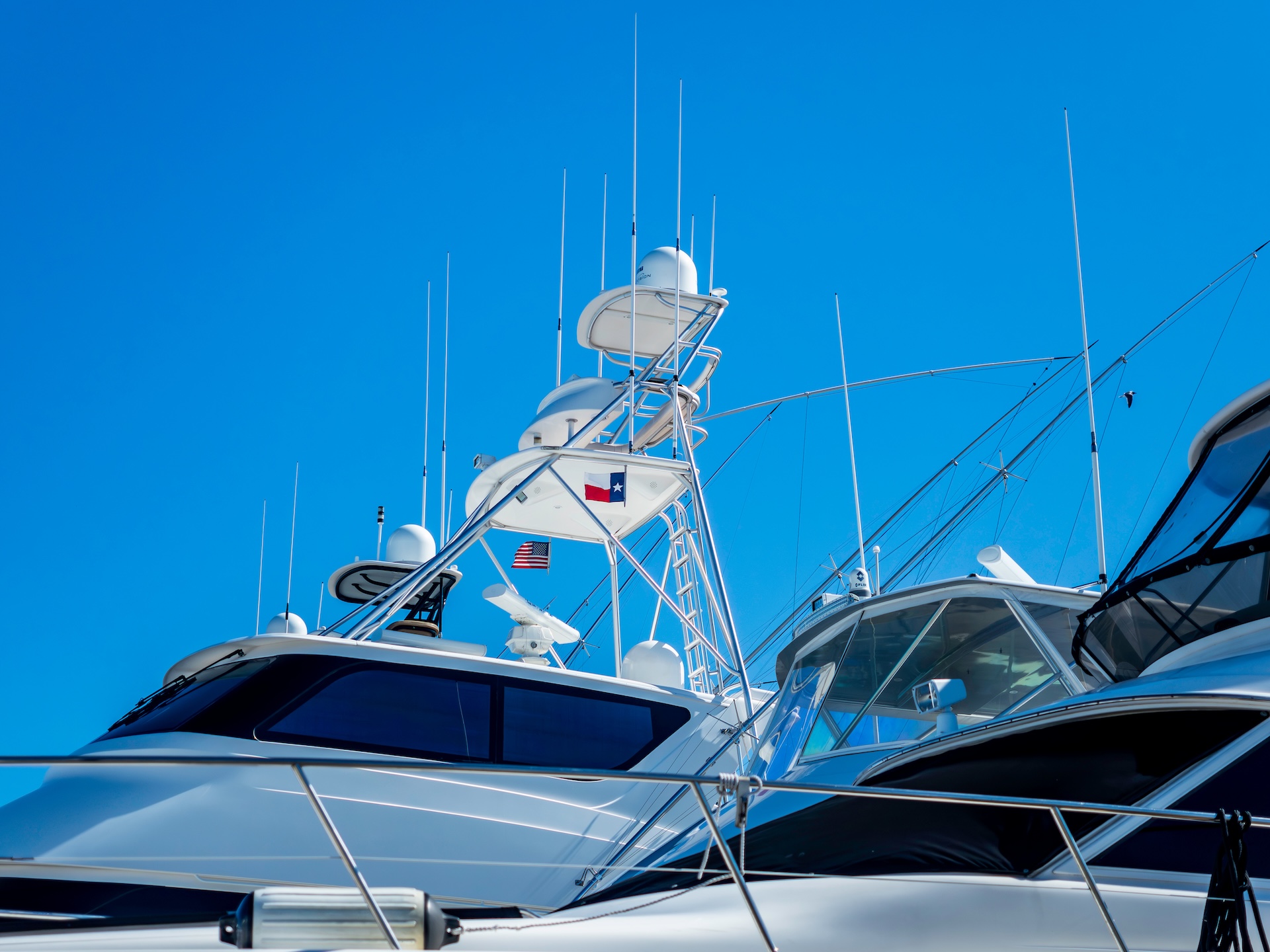 Looking up at Texas flag on large boat. 