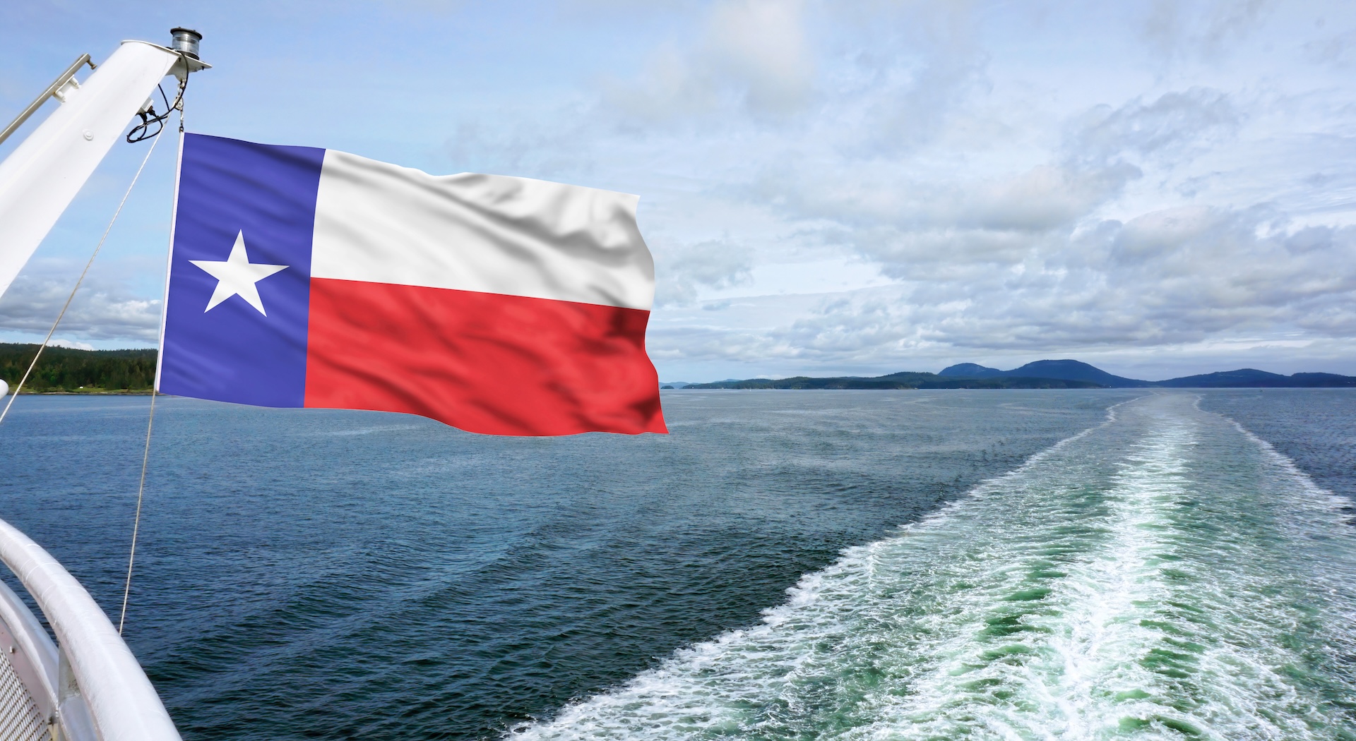 Texas flag on back of boat over the water, how to get a boating license in Texas concept. 