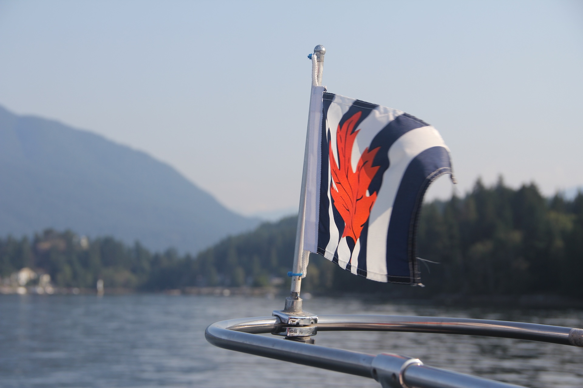 Canadian Power and Sail Squadrons flag on a boat, nautical signal flags concept.