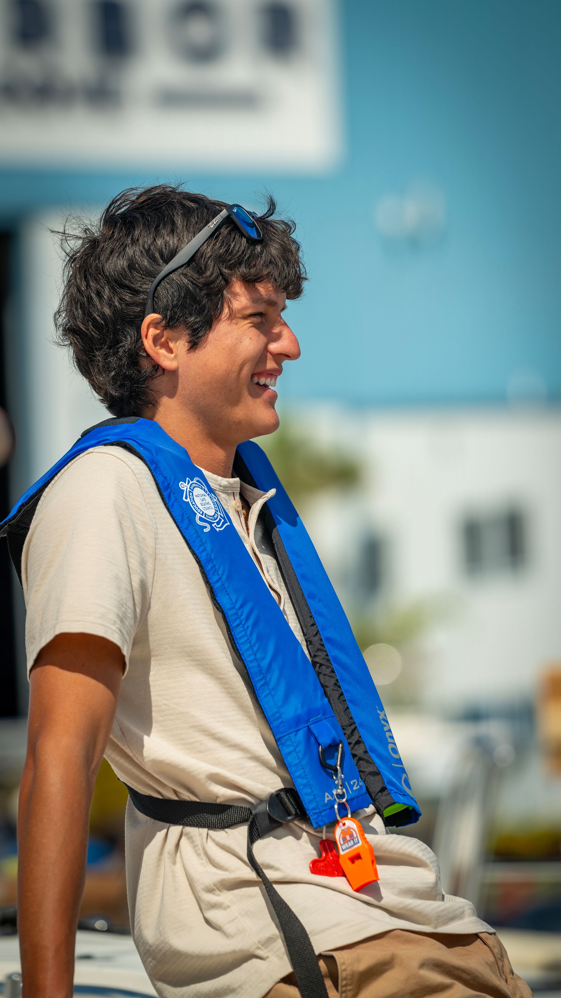 Young smiling guide in a life vest. 