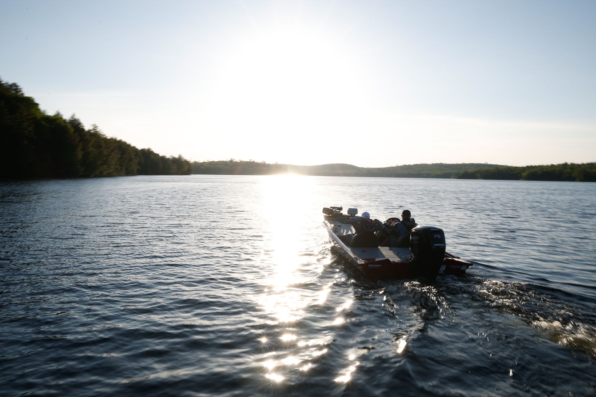 Fishing boat on a lake, do you need a boaters license in Arizona concept.