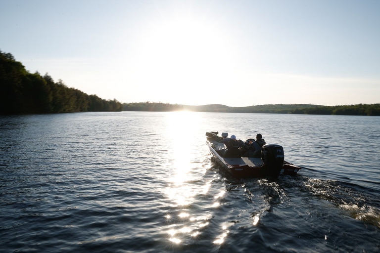 Fishing boat on a lake, do you need a boaters license in Arizona concept. 