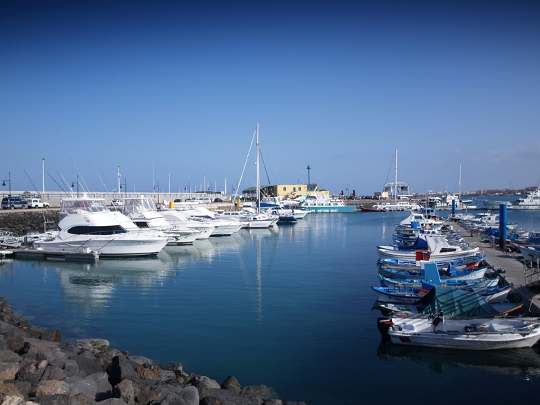 Boats docked at a marina, boat size concept. 