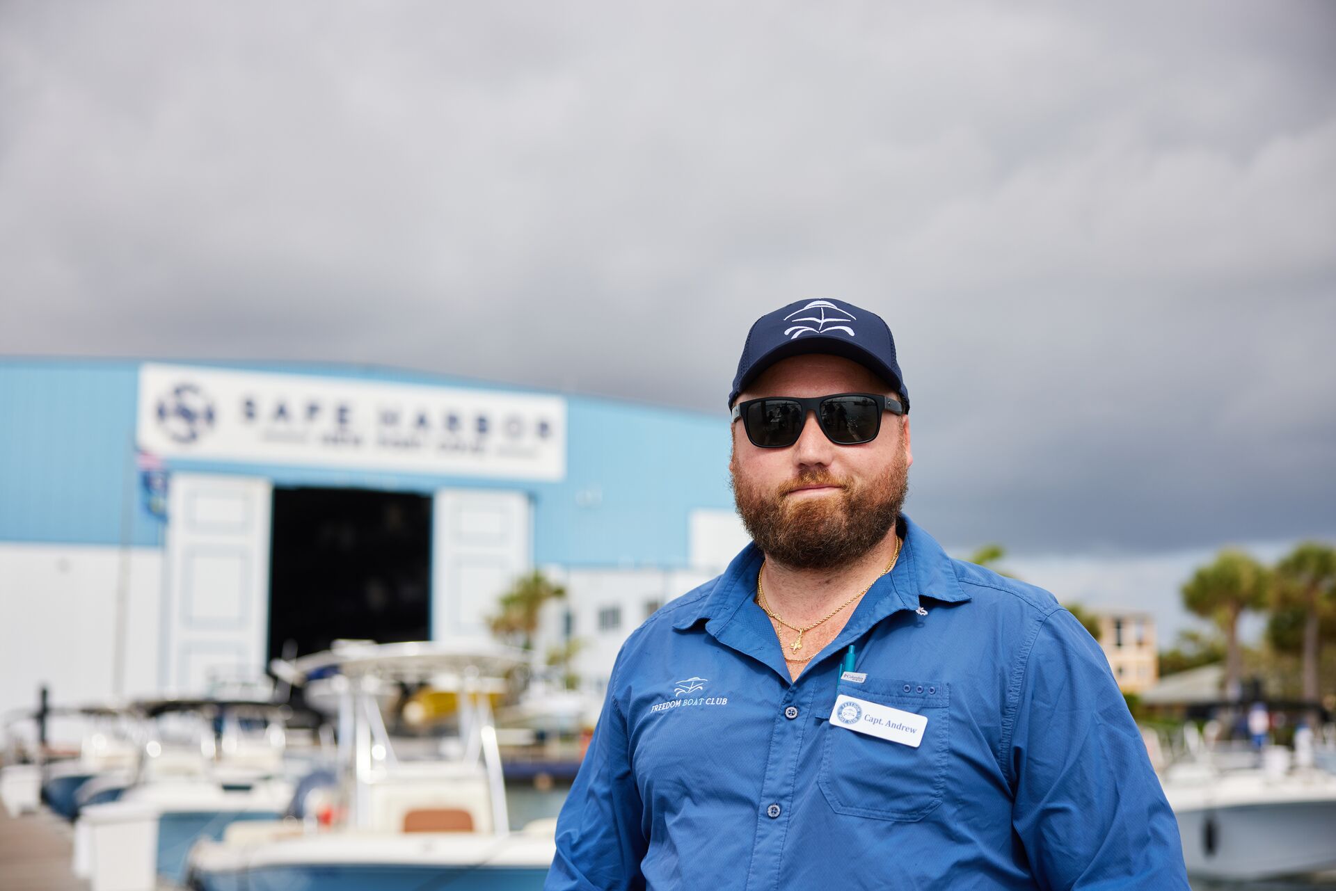 Man in blue shirt smiles, do you need a boating license in California concept. 