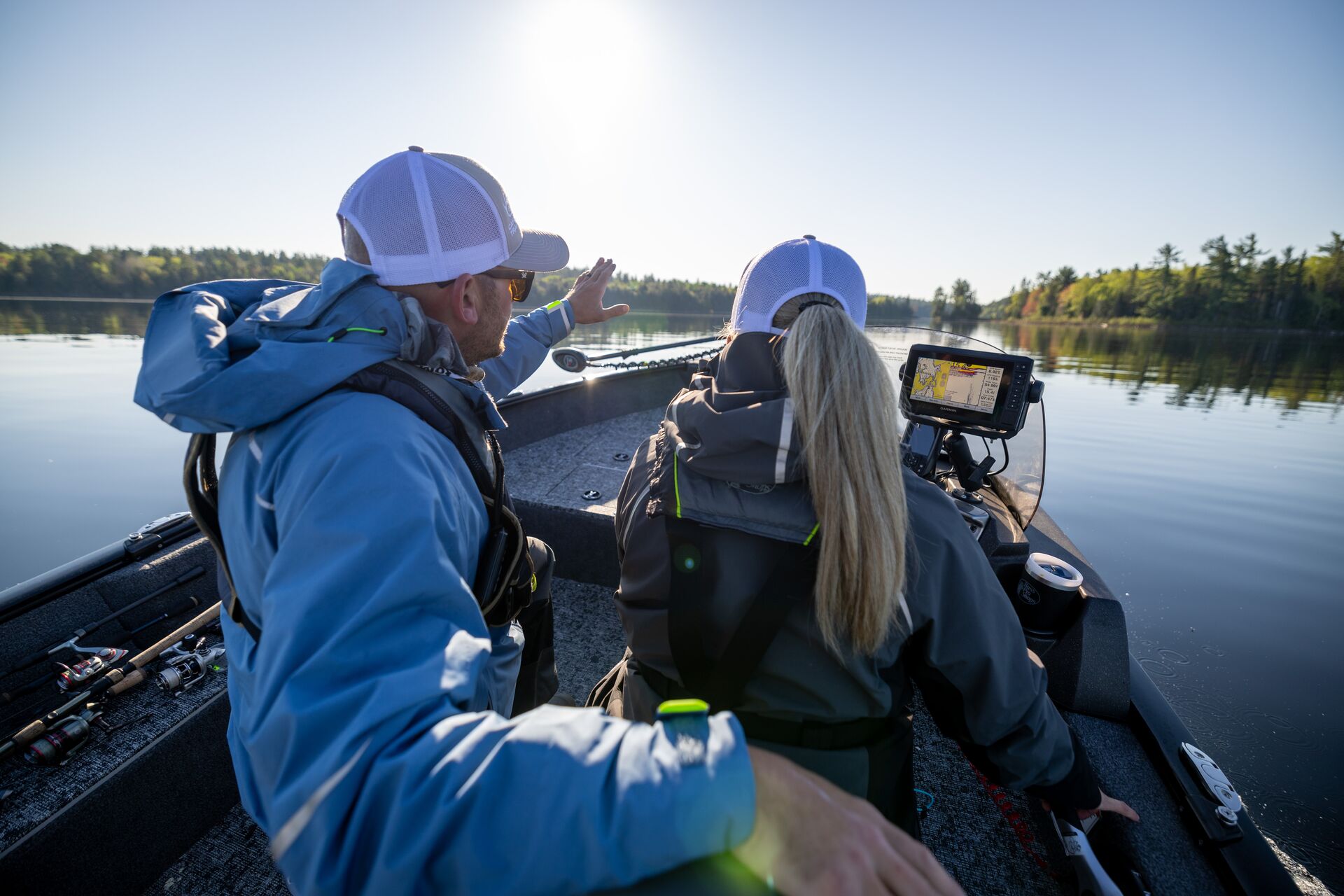 Instructor with student driving a boat.