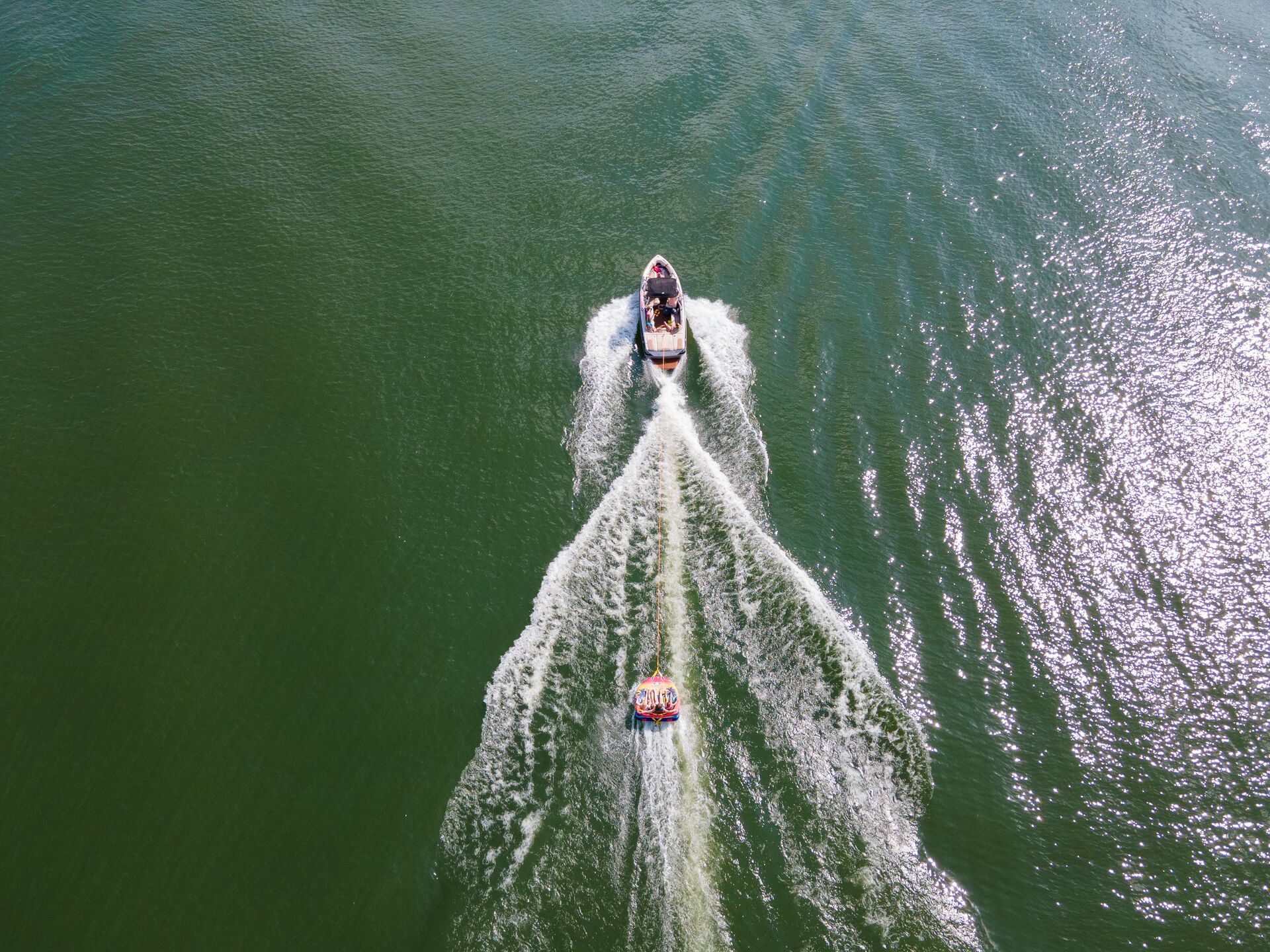 Overhead view of boat pulling tube, do you need a boating license in Illinois concept. 