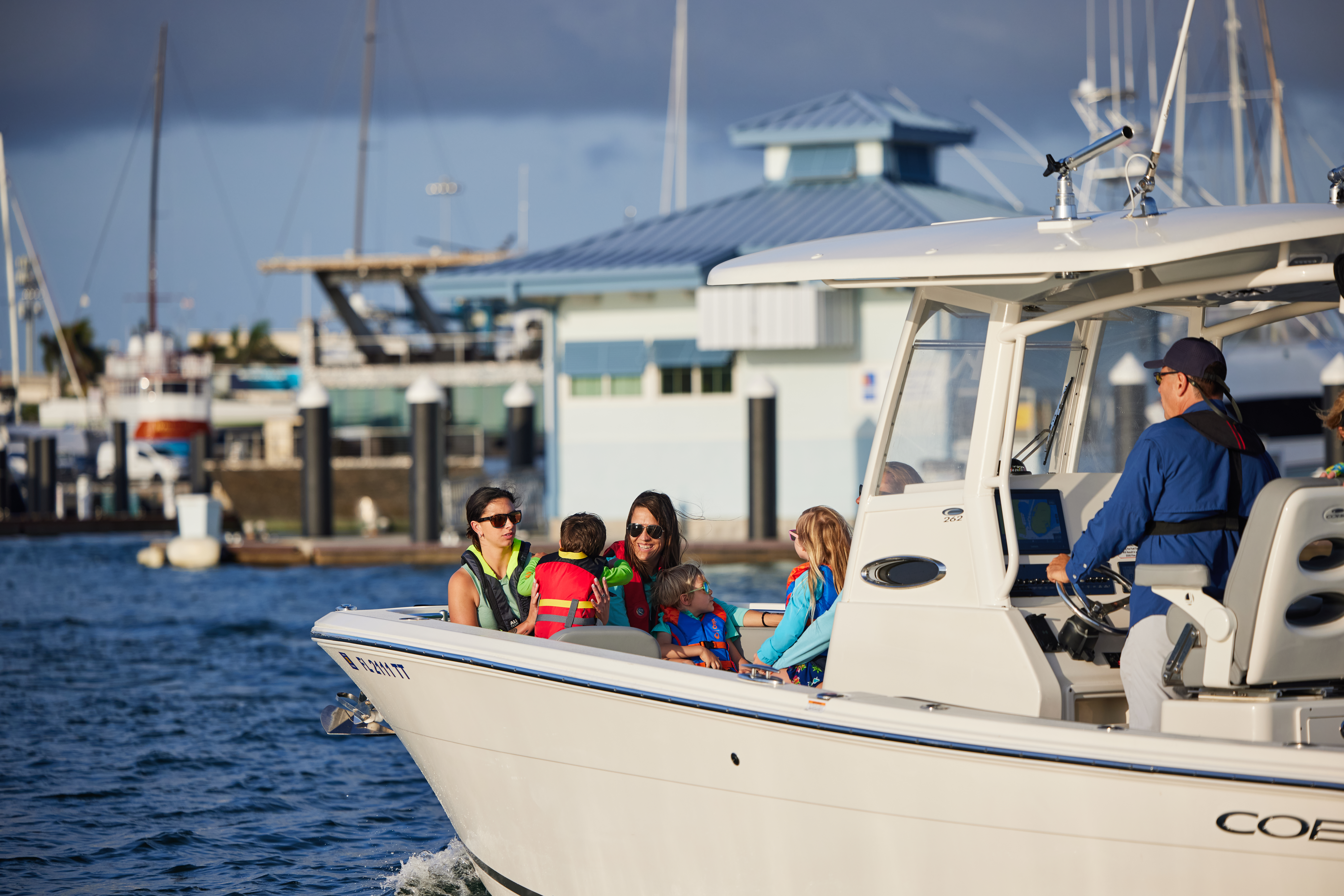 Boaters wearing lifejackets practice safe boating tips. 