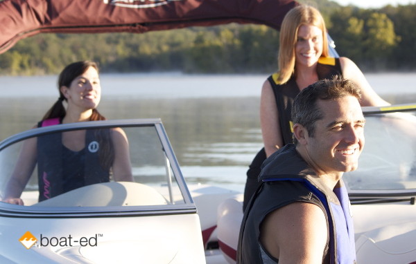 People wearing life jackets on a boat.