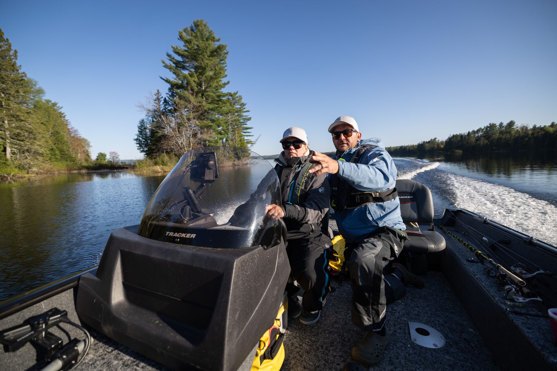 Boat instructor with student on boat, what is a boater education card concept. 