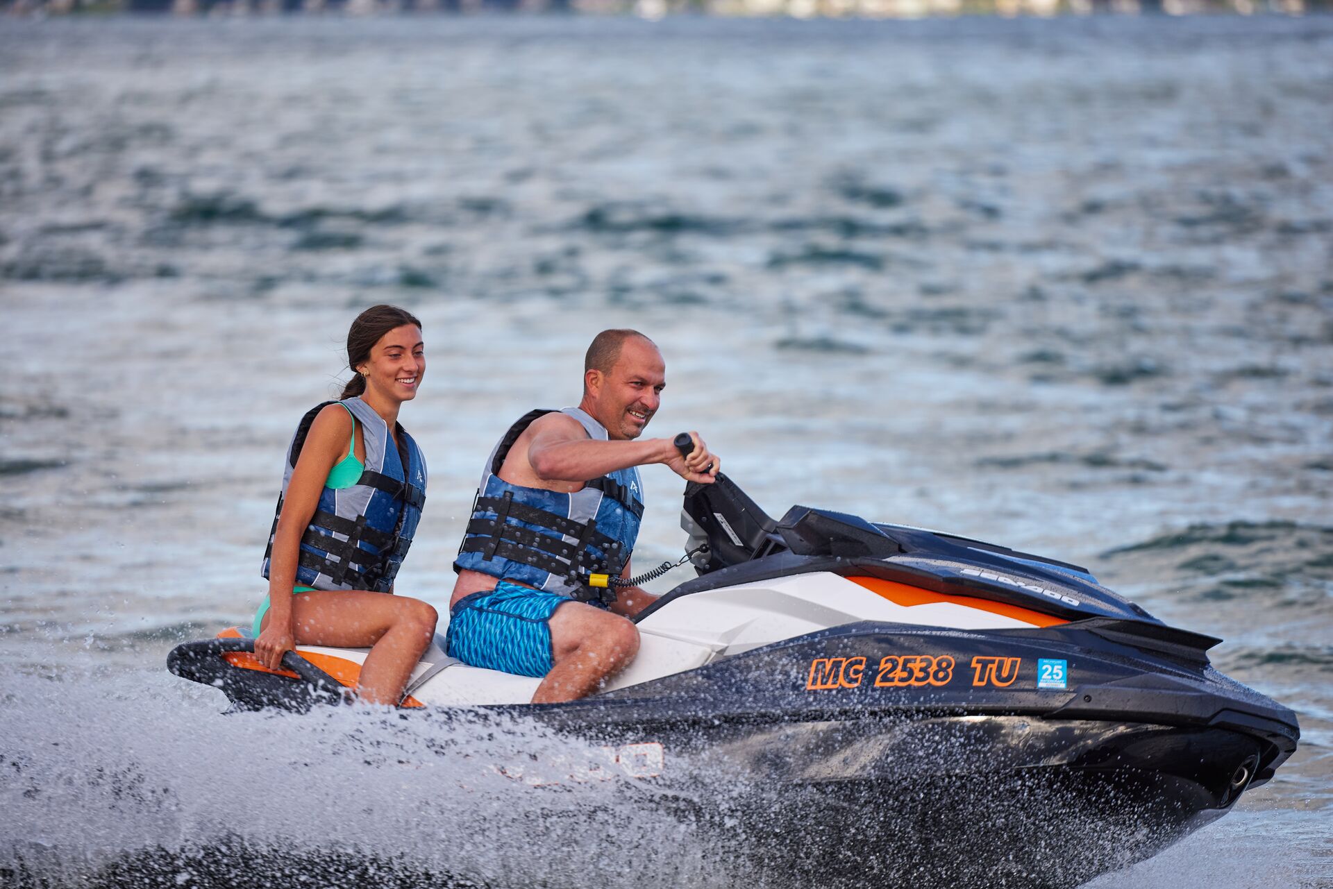 Girl and man on PWC, do you need a license to rent a boat in New York concept.