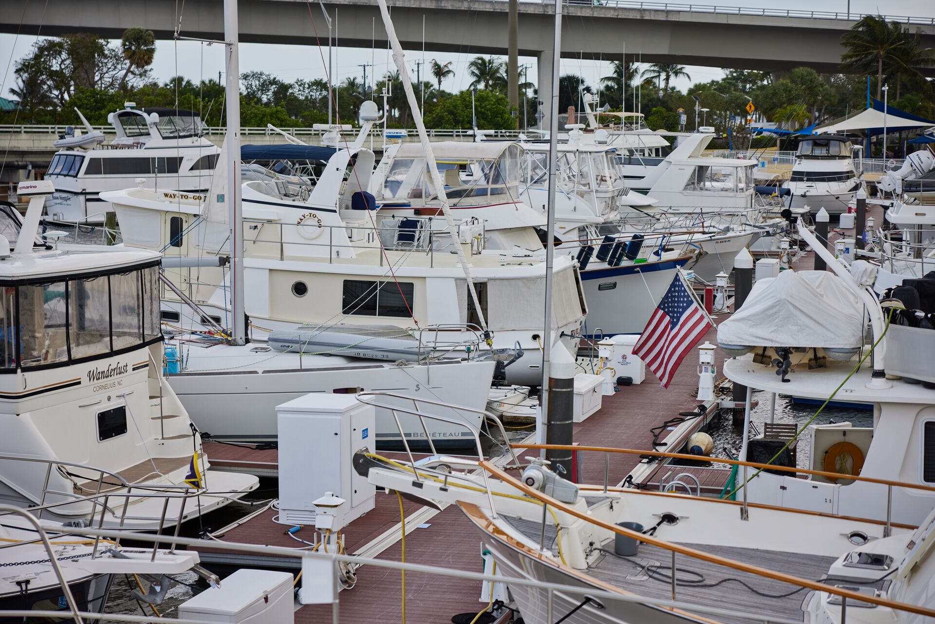 Many boats docked at marina, do you need a license to rent a boat in New Jersey concept.