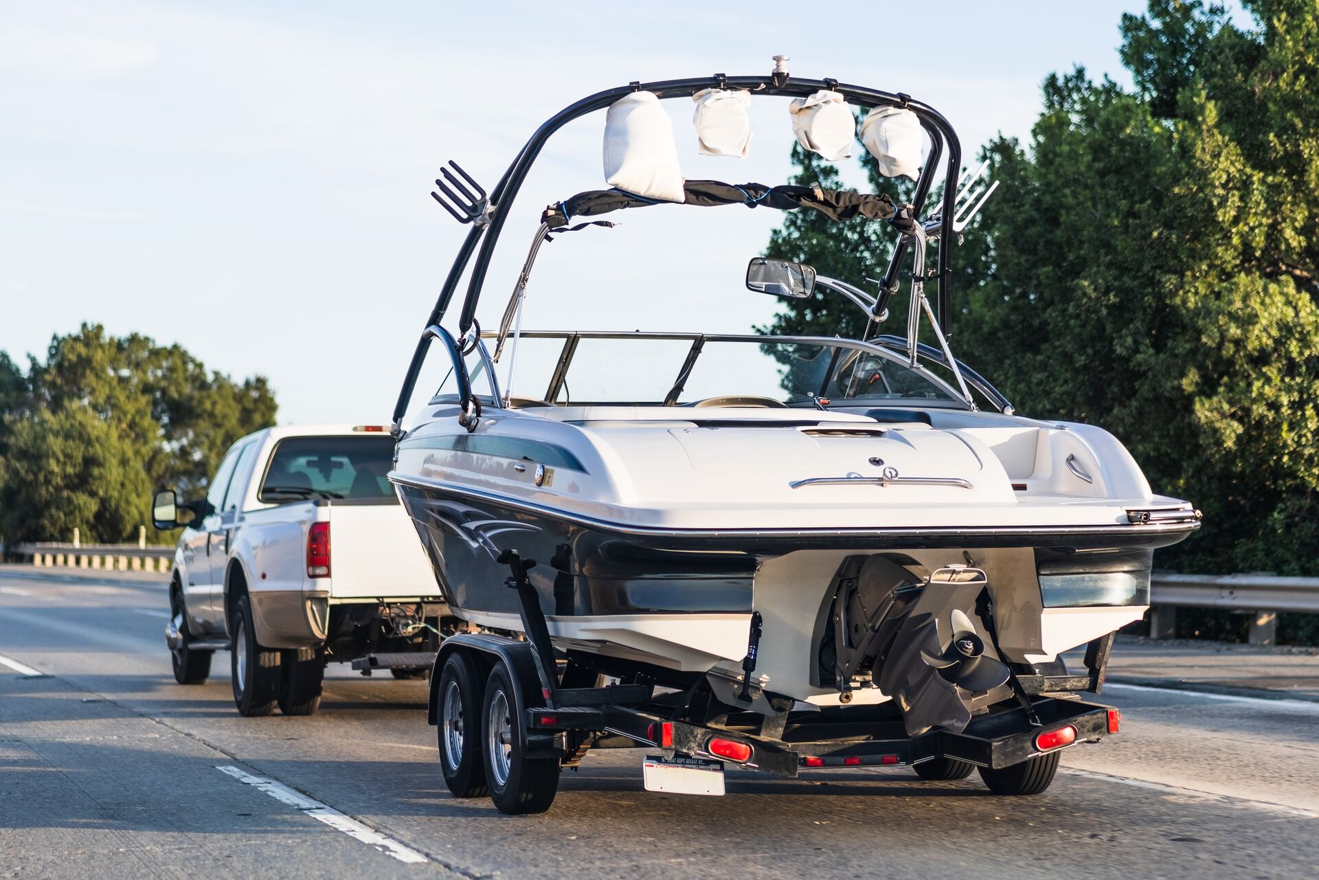 Truck pulls boat on a trailer, Pennsylvania boat rental license concept. 