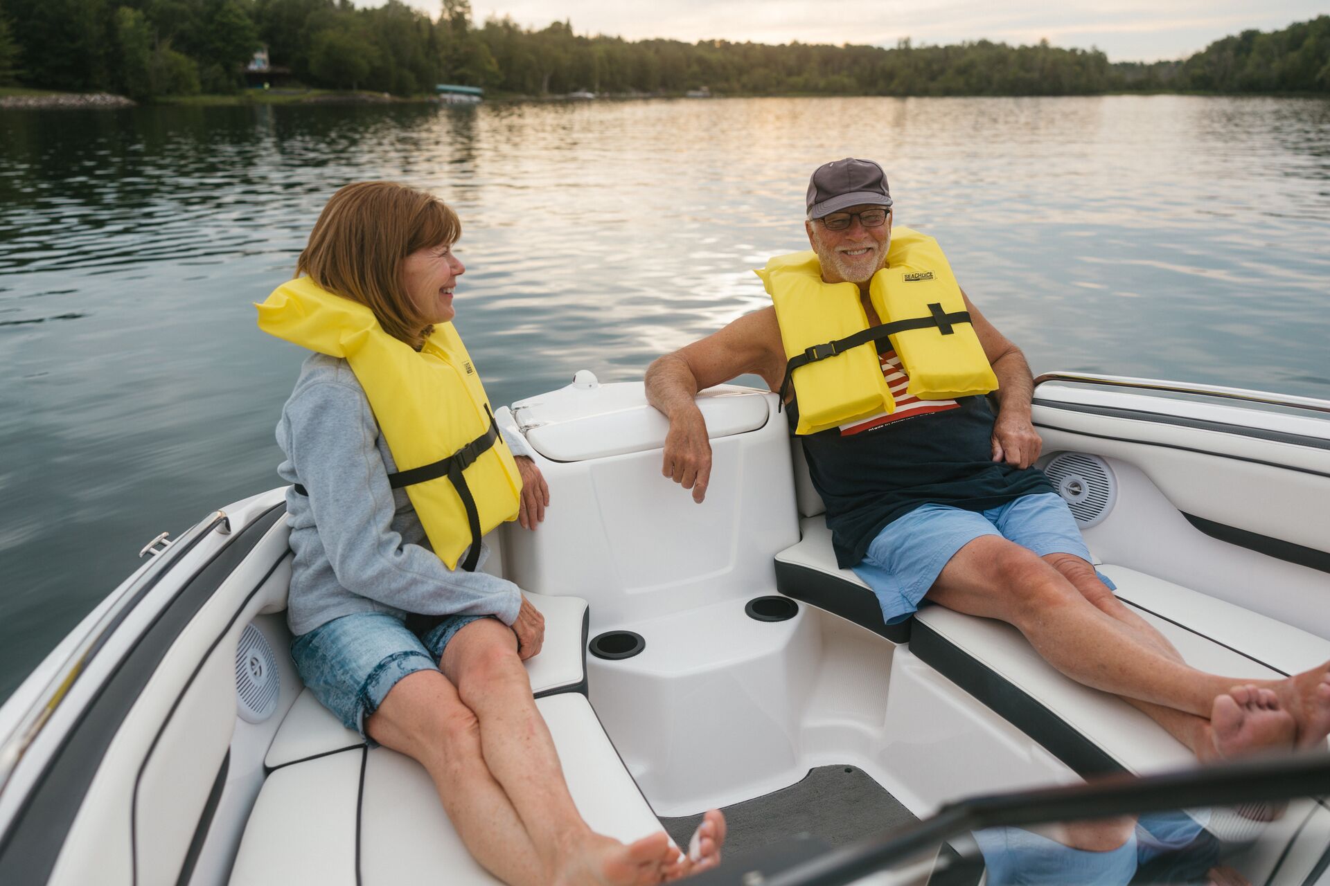 Man and woman in yellow life vests sit in boat, do you need a license to rent a boat in Pennsylvania concept.