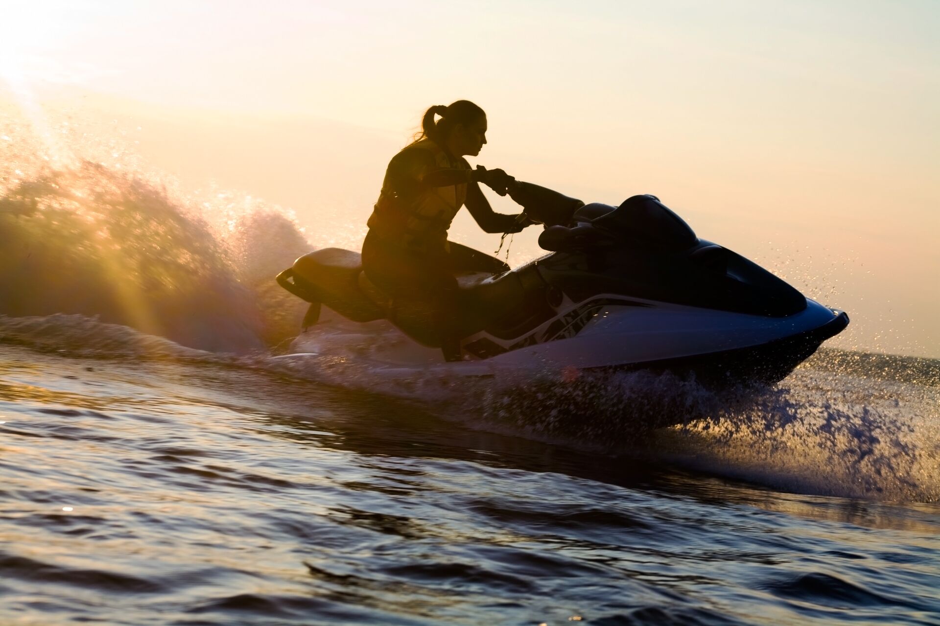 Girl on jet ski on the water, rent a boat or PWC in Texas concept. 