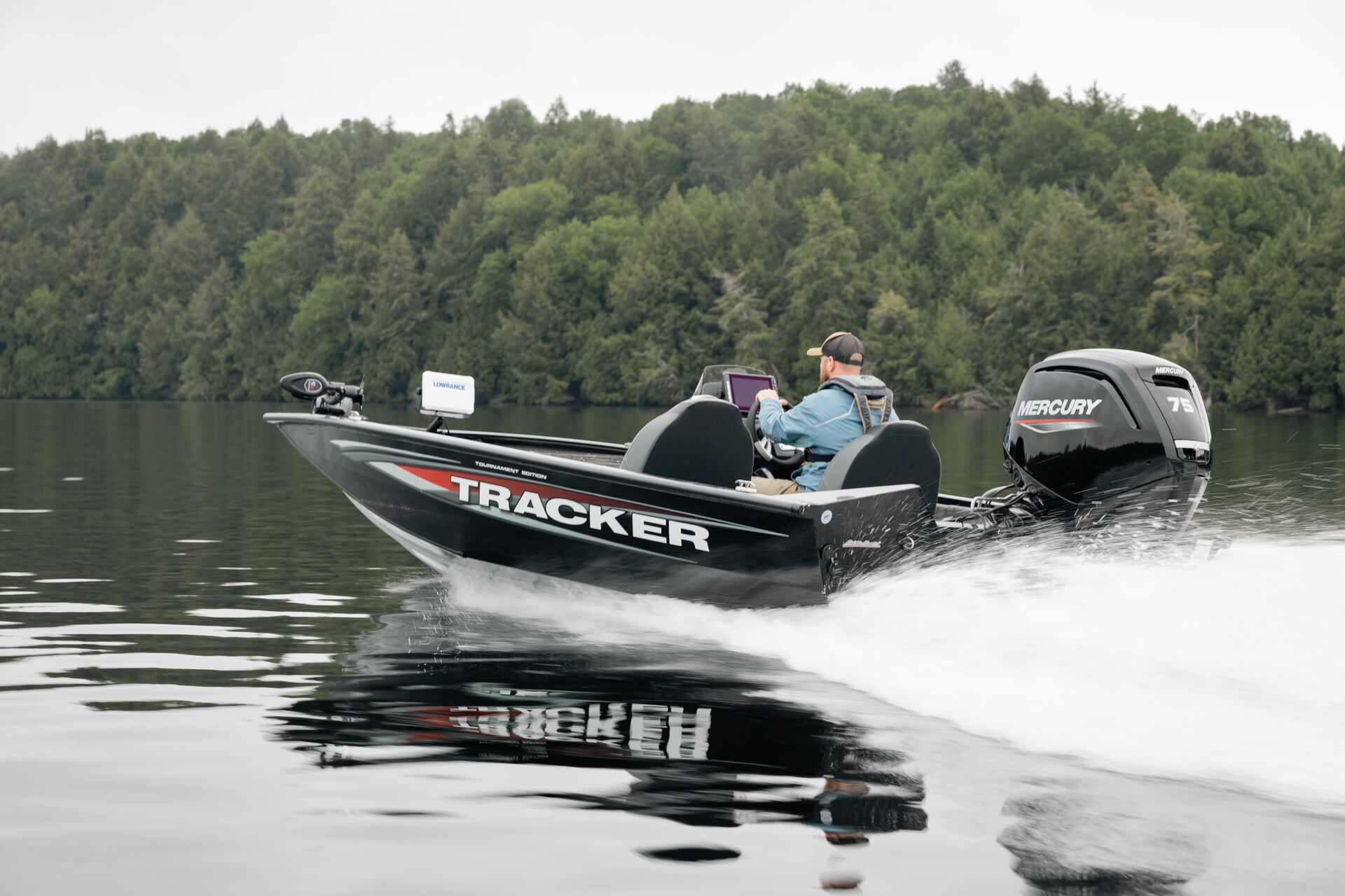 Man drives black bass boat on a lake, Texas boat rental license concept. 