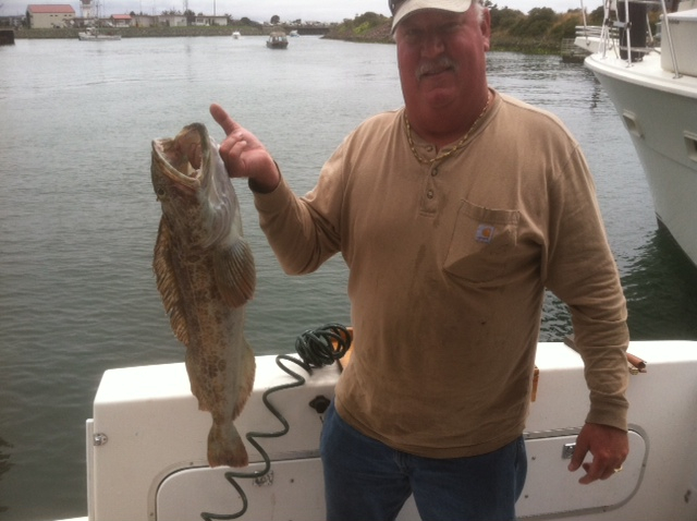 A fisherman holding his catch, boat safety concept.