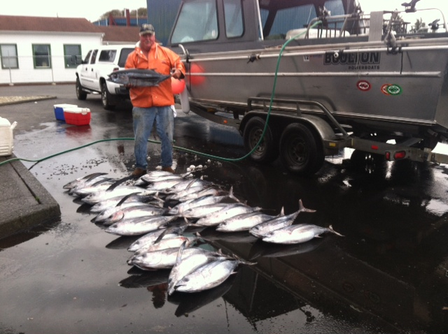 A boater with a display of their catches for the day, avoid boating accidents concept. 