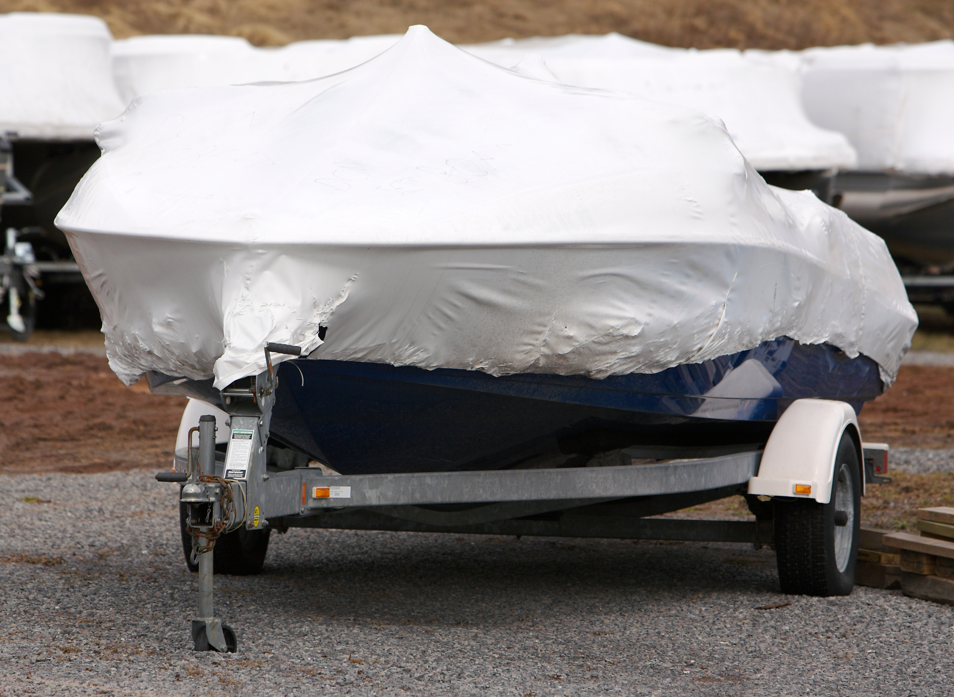 A covered boat, how to winterize your boat concept. 