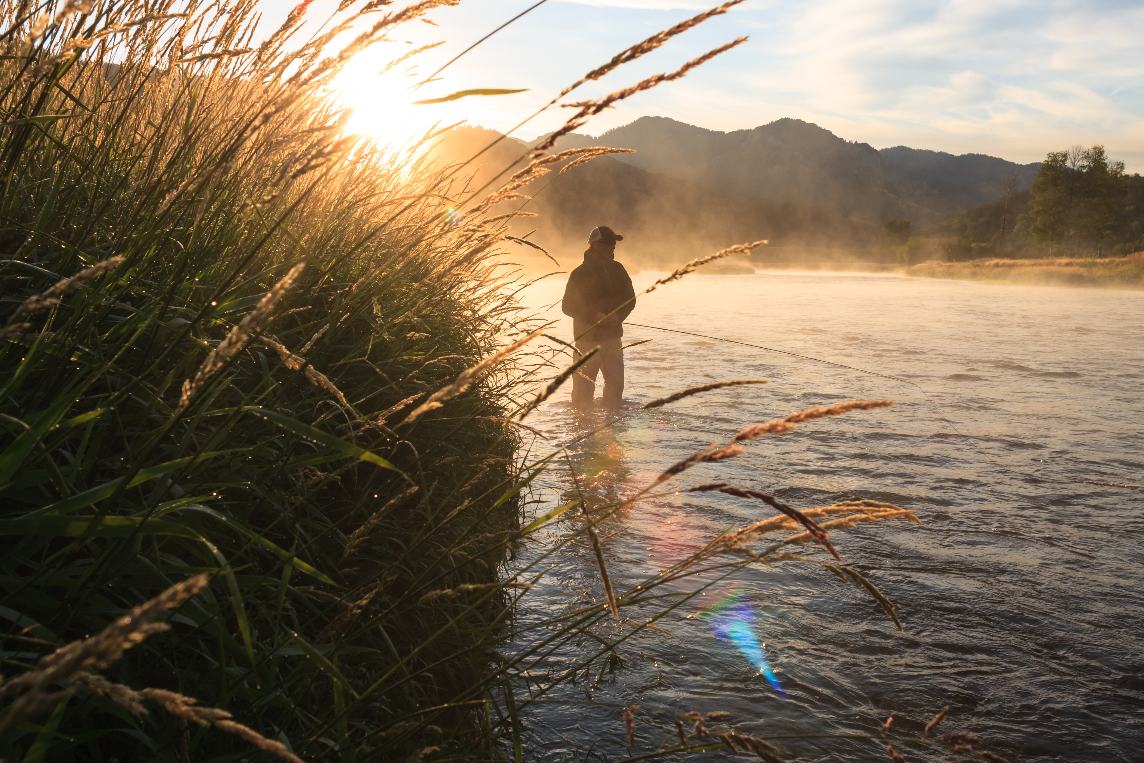 A man fishing in the water, fishing for walleye concept. 