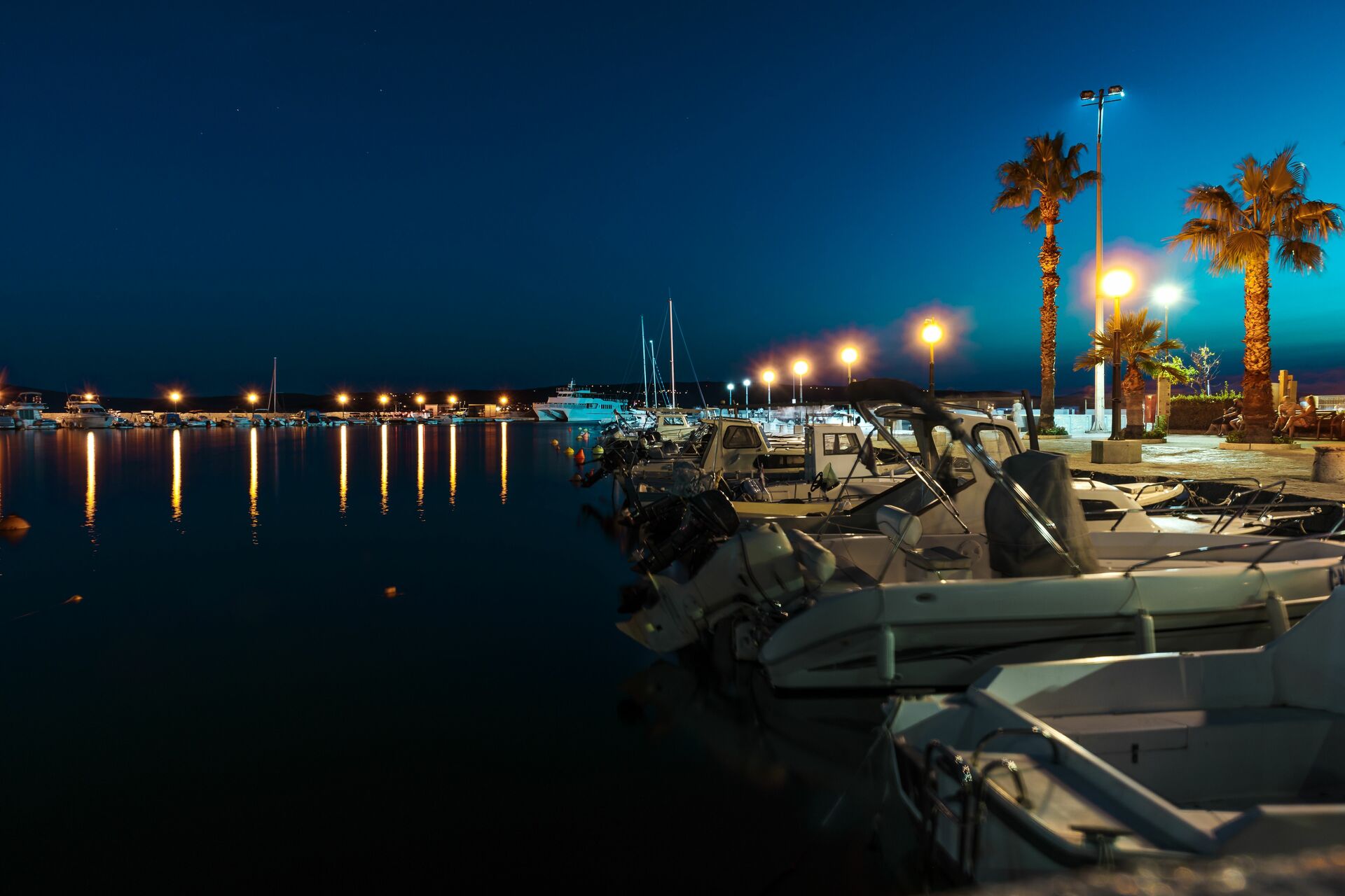Boats at the marina at night, what boat lights are required at night concept. 
